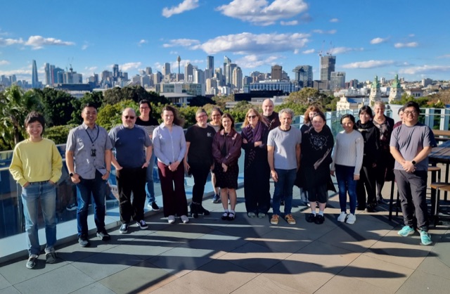 Workshop group photo with the Sydney skyline